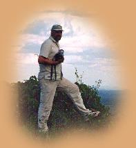 Typical safari wear : 'zippy' trousers ; light weight shirt ; baseball cap ; comfortable footwear